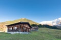 Sun burned timber chalet hut on austrian mountains