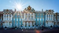 Sun burst over the ornate gold, blue and white exterior of Catherine`s Palace in Pushkin, St Petersburg, Russia