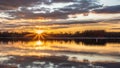 The sun bursts through the clouds at dawn on Blue Marsh Lake in Berks County, PA