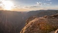 Sun Bursts at Sunset Over Black Canyon Royalty Free Stock Photo