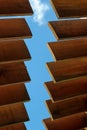 The sun canopy, the wooden slats on the sky background, part of the roof Royalty Free Stock Photo