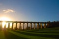 The sun casting long shadows at the Balcombe Viaduct across the River Ouse