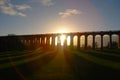 The sun casting long shadows at the Balcombe Viaduct across the River Ouse