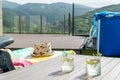 Sun chair with a hat on it and two cocktails on a table Royalty Free Stock Photo