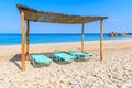 Sun chairs on Potami beach, Samos island, Greece Royalty Free Stock Photo