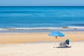 Sun chairs and umbrella on beach Royalty Free Stock Photo