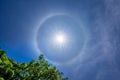 Sun with a circular rainbow,Fantastic beautiful sun halo phenomenon in Thailand Royalty Free Stock Photo