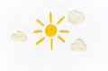 Sun and clouds on white made from plasticine Royalty Free Stock Photo