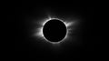 Sun completely covered by moon during a total solar eclipse, revealing the stunning corona surrounding the dark disk of Royalty Free Stock Photo