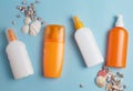 Sun cream, cream, sunscreen bottle, sun cream, lotion bottle, seashells. Beach flat lay accessories. Royalty Free Stock Photo