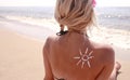 Of sun cream on the female back on the beach Royalty Free Stock Photo