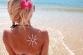 Of sun cream on the female back on the beach Royalty Free Stock Photo