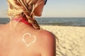 Of sun cream on the female back on the beach Royalty Free Stock Photo