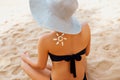 Sun cream. Suntan Lotion Beautiful Woman Applying on beautiful on Shoulder. Sunscreen Solar Cream. Royalty Free Stock Photo