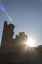 Sun crossing castle ruins Royalty Free Stock Photo