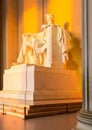 Sun at dawn illuminates Lincoln statue