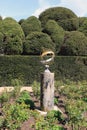 Sun dial and topiary hedge