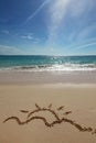 Sun drawing on a beach Royalty Free Stock Photo