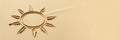 Sun drawing in the sand on a beach with room for text Royalty Free Stock Photo