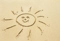 Sun drawing on sandy beach Royalty Free Stock Photo