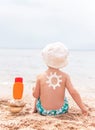 The sun drawing sunscreen on baby (boy) back. Royalty Free Stock Photo