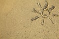 Sun drawn on the sand of a beach. Happy. Royalty Free Stock Photo