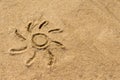 Sun drawn on the sand of the sea Royalty Free Stock Photo