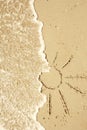 Sun drawn in the sand on the seashore Royalty Free Stock Photo