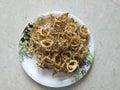 Sun Dried Bitter melon or Sun Dried Karela in a plate. Sundried bittergourd chips or Karathe ,kachri, hagalkayi ,sandige. It can b Royalty Free Stock Photo