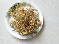 Sun Dried Bitter melon or Sun Dried Karela in a plate. Sundried bittergourd chips or Karathe ,kachri, hagalkayi ,sandige. It can b Royalty Free Stock Photo