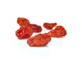 Sun-dried cocktail tomatoes on a white background