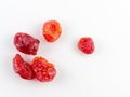 Sun-dried cocktail tomatoes on white background