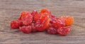Sun-dried cocktail tomatoes on a wood background