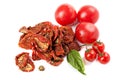 Sun dried tomatoes with basil and ripe tomatoes Royalty Free Stock Photo