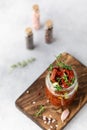 Sun dried tomatoes with fresh herbs and spices, sea salt in olive oil in a glass jar. Top view. Print for kitchen Royalty Free Stock Photo