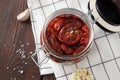 Sun dried tomatoes with herbs and sea salt in olive oil in a glass jar Royalty Free Stock Photo