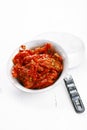 Sun-dried tomatoes with olive oil in an old tinware Royalty Free Stock Photo