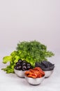 Set of delicious snacks. Sun-dried tomatoes and olives with fresh herbs Royalty Free Stock Photo