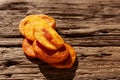 Sun Dried whole peach fruits on old cracked wooden surface. Healthy alternative sweets. Selective focus, copy space Royalty Free Stock Photo