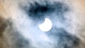 Sun eclipse (partial) with a cloudy sky around Royalty Free Stock Photo