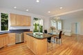 Sun filled gourmet kitchen with wooden cabinetry