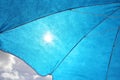 Sun Filtering Through Blue Sun Umbrella Royalty Free Stock Photo