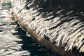 Sun glare on glossy board of mega yacht, anchor, tranquillity in port Hercules, bow of moored huge boat at sunny day Royalty Free Stock Photo