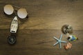 Sun glass and small boat and compass decorate on wooden table with starfish world glass marble and turtle Royalty Free Stock Photo