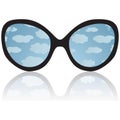 Sun glasses with reflexion of the sky and clouds Royalty Free Stock Photo