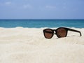 Sun glasses on Sand Beach Summer Holiday Travelling background Royalty Free Stock Photo