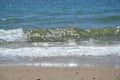 Sun glistening on clear water by the beach