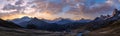 Sun glow in evening hazy sky. Mountain panoramic peaceful view from Giau Pass