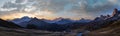 Sun glow in evening hazy sky. Mountain panoramic peaceful view from Giau Pass