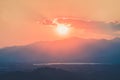 Sun goes down behind the mountains Royalty Free Stock Photo